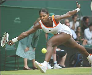 Serena Williams stretches to play a low forehand