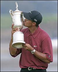 Tiger Woods celebrates with the trophy after claiming his first US Open win 