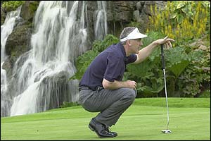 Wales' Philip Price lines up a putt