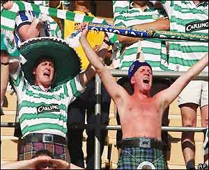 The Celtic fans sing in the stadium