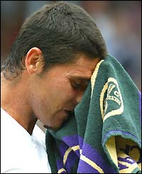 Mark Philippoussis towels down his face
