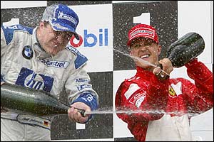 The Schumacher brothers celebrate as Ralf wins the French GP and Michael comes in third 