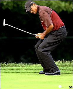 Woods en route to a tied tournament record 21-under par