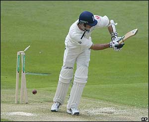 England's Michael Vaughan is bowled by Heath Streak