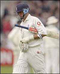 Nasser Hussain walks from the field after getting out for 19
