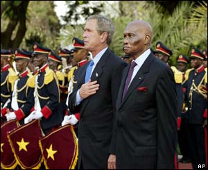 US President George W Bush is welcomed to the presidential palace in Dakar by Senegal's President Abdoulaye Wade 
