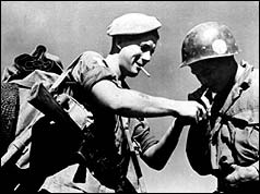 Cpl. Tony Gibbs of the 1st Middlesex Regiment (British Army) and Pte. Peter Mercbain of the United States 8th Army.