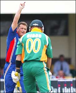 Darren Gough celebrates in front of a disappointed Herschelle Gibbs