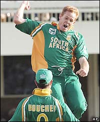Shaun Pollock jumps in the air in delight at taking the wicket of Marcus Trescothick