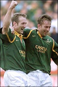 South Africa's Stefan Terblanche and Corne Krige celebrate after beating Australia