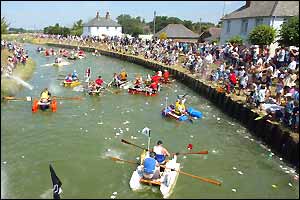 Competitors row down the Adur River in bath tubs during the 32nd Adur Bath Tub Race in West Sussex, England