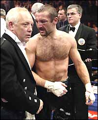 A battered Scott Harrison reflects on losing his WBO featherweight title to veteran Mexican Manuel Medina