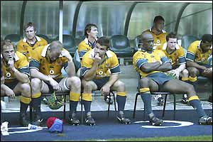 Australia's players are dejected after their 26-22 defeat against South Africa in the Tri-Nations match in Cape Town