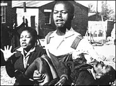 Hector Petersen is carried away by Mbuyiswa Makhubo after the riots 