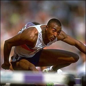 Britain's Colin Jackson wins the 110m hurdles and breaks the world record