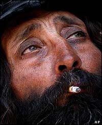 A man smokes a cigarette
