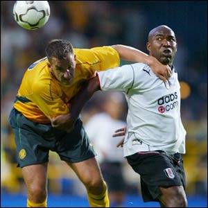 Fulham's Barry Hayles battles with Celtic's John Kennedy during their pre-season friendly at Loftus Road