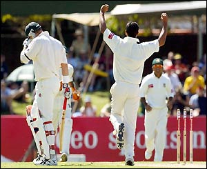 Bangladesh bowler Mashrafe Mortaza, right, raises his arms in celebration after bowling Australia's Matthew Hayden