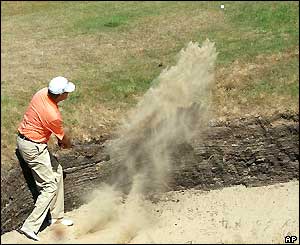 Davis Love II plays out of a bunker
