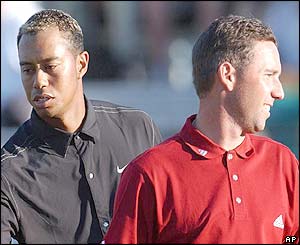 Tiger Woods and Sergio Garcia leave the eighteenth green