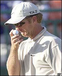 2001 Open winner David Duval walks off the 18th green