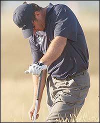 England's Nick Faldo reacts after a bad shot