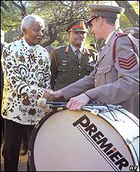 Nelson Mandela meets members of the Military Health Services band outside his home 