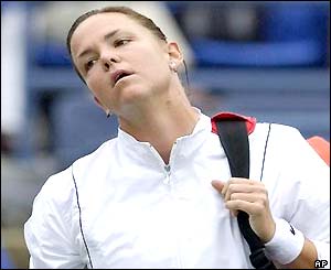 Lindsay Davenport looks frustrated as she walks off court