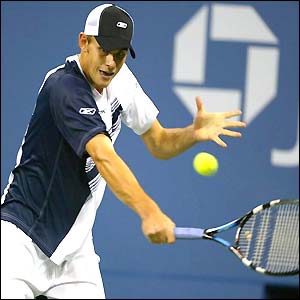 Andy Roddick hits a backhand against Xavier Malisse