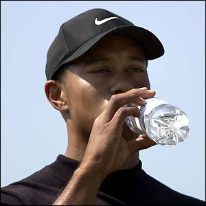 Tiger Woods takes a drink after a terrific front nine on the third day of the Open