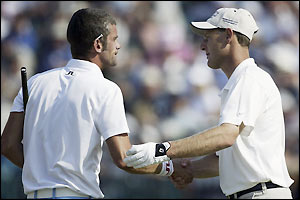 Jesper Parnevik and Mark Roe shake hands after completing their rounds