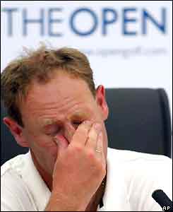 Mark Roe looks distraught at a press conference