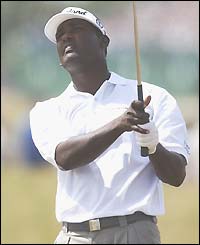 Vijay Singh watches his ball after driving