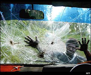 Bullet holes in a mini-bus windscreen, region of Guadalcanal