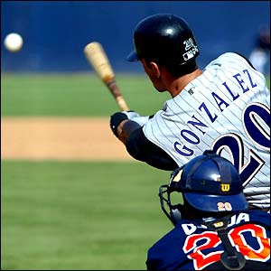 Arizona Diamondbacks' Luis Gonzalez connects for a hit against the San Diego Padres