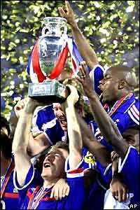 French captain Didier Deschamps holds aloft the trophy 