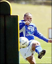 Brazil's Roberto Carlos tries a free kick during a training session at Granja Comary in Rio de Janeiro