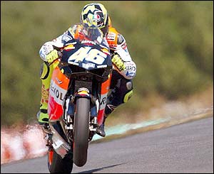 Italian MotoGP rider Valentino Rossi drives his Honda at the Moto Grand Prix of Portugal 