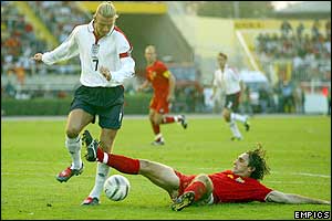 England captain David Beckham battles with Macedonia's Igor Mitrevski 