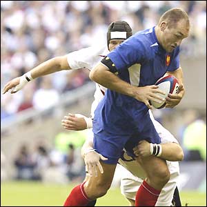 Ben Kay of England tackles Olivier Brouzet