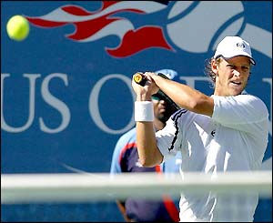 David Nalbandian watches his shot go over the net