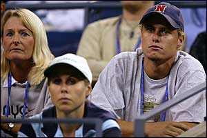 Lleyton Hewitt and his mother watch as Clijsters fails to get to grips with the match