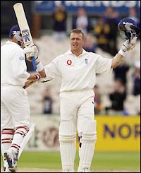 Stewart celebrates his century at Old Trafford