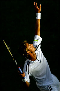 Juan Carlos Ferrero serves during the US Open final
