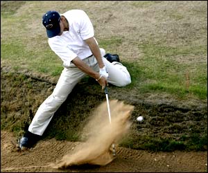 Trip Kuehne of the USA plays out of the bunker on the seventh hole at Ganton 