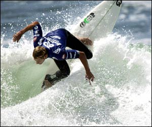 Richard Lovett performs a backhand re-entry to clinch the Boost Mobile Pro title at Lower Trestles, California