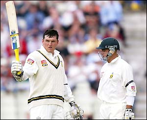 Graeme Smith salutes his century watched by Herschelle Gibs