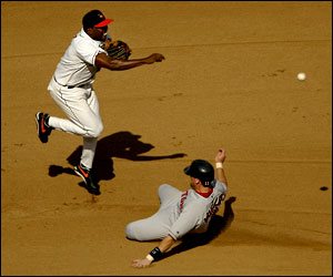 Baltimore Orioles shortstop Deivi Cruz slides in