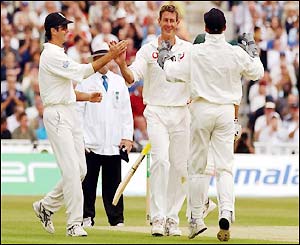 Ashley Giles is congratulated by team-mates after dismissing Gary Kirsten