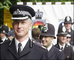 Commander Brian Paddick leads uniformed police officers